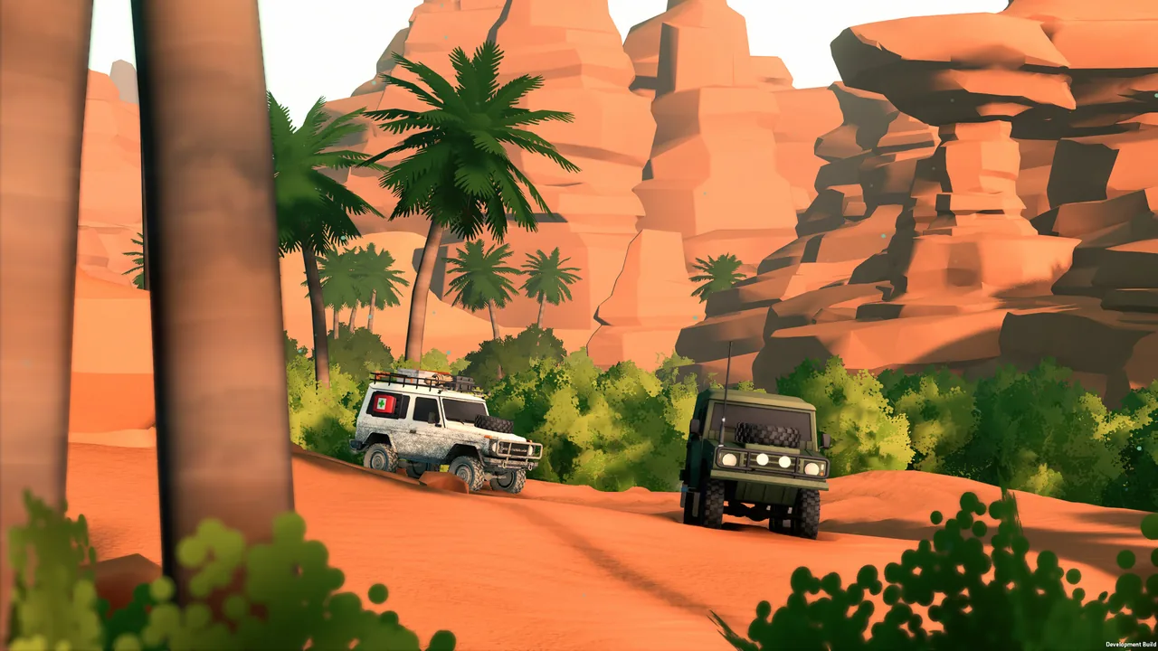 A white off-roader and an olive-green off-roader drive on a sandy orange track between palm trees and tall red sandstone cliffs.